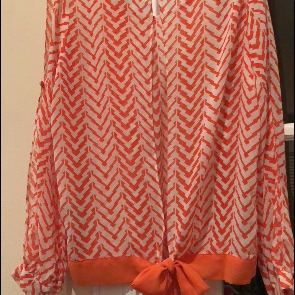 Orange and white top
